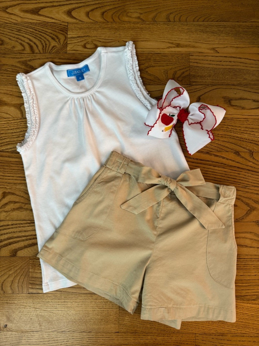 J. Bailey White Ruffle Sleeve Top with Tan Bow-Tie Shorts